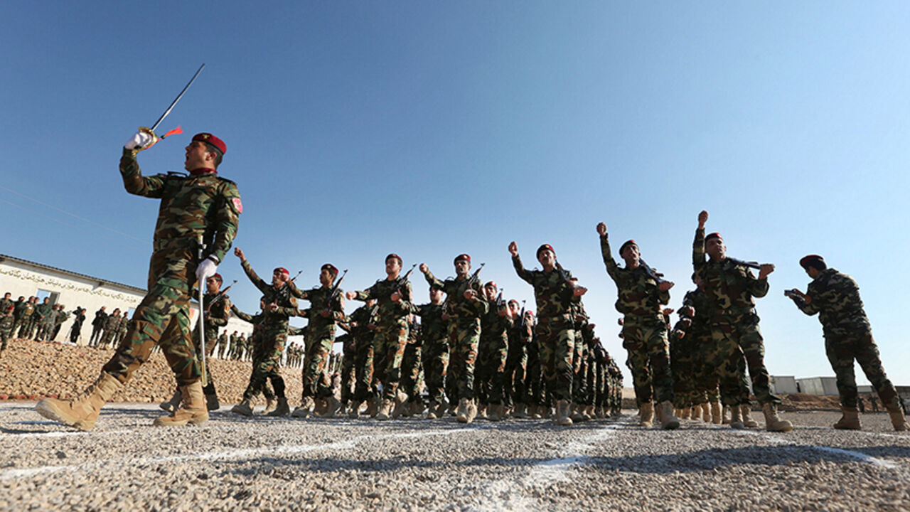 MIDEAST-CRISIS-IRAQ A group of Arab soldiers who have joined Kurdish peshmerga forces take part their graduation ceremony at a training camp in Duhok province, Iraq, February 7, 2017. REUTERS/Ari Jalal - RTX2ZZVX