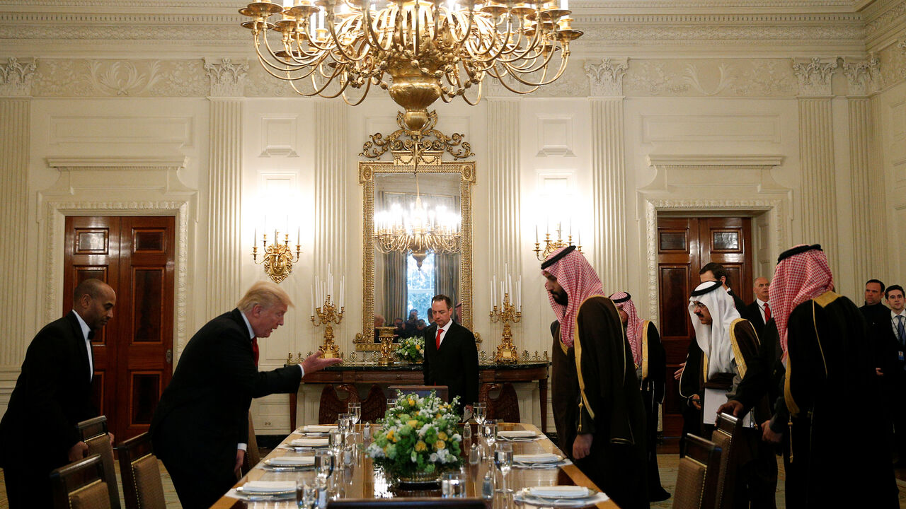 USA-SAUDI/DEFENSE U.S. President Donald Trump and Saudi Deputy Crown Prince and Minister of Defense Mohammed bin Salman take their seats for lunch in the State Dining Room of the White House in Washington, U.S., March 14, 2017. REUTERS/Kevin Lamarque - RTX30ZV5