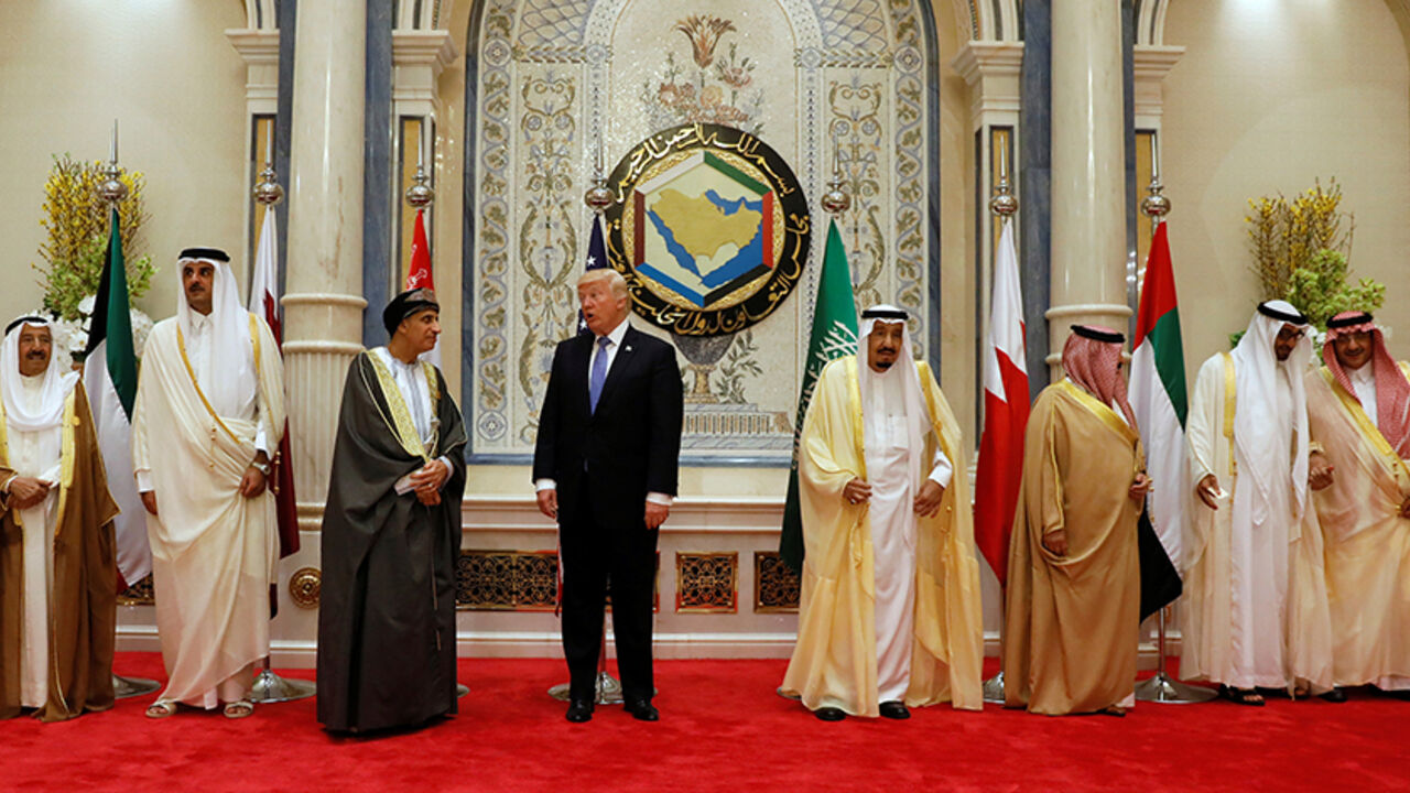 USA-TRUMP/SAUDI U.S. President Donald Trump (4-L) speaks with Oman's Deputy Prime Minister Fahd bin Mahmoud Al-Said (3-L) during a family photo with Gulf Cooperation Council leaders at their summit in Riyadh, Saudi Arabia May 21, 2017. REUTERS/Jonathan Ernst - RTX36TI7