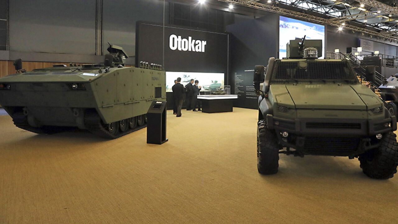 AFP_BT5TR People stand near by military vehicles displayed by Turkish company Otokar on June 13, 2016 during the the Eurosatory defence and security international exhibition in Villepinte, near Paris. / AFP / Jacques DEMARTHON (Photo credit should read JACQUES DEMARTHON/AFP/Getty Images)