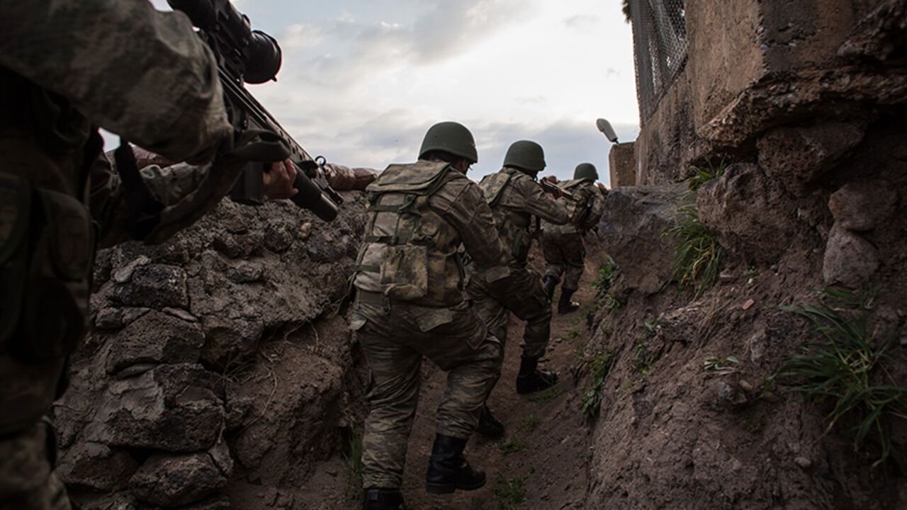94758674 KILIS, TURKEY - MARCH 02: Turkish soldiers from the 1st Border Regiment Command run through alert drills at a military outpost on the Turkey/Syria border on March 2, 2017 in Kilis, Turkey. The military exercises were held to display the new border wall and new security measures such as thermal scanning and patrols by the new Tactical Armoured Reconnaissance vehicles (Kobra-2) that are being used to tighten Turkey's border. The government announced this week that more than half of the 511-kilometer wall ha