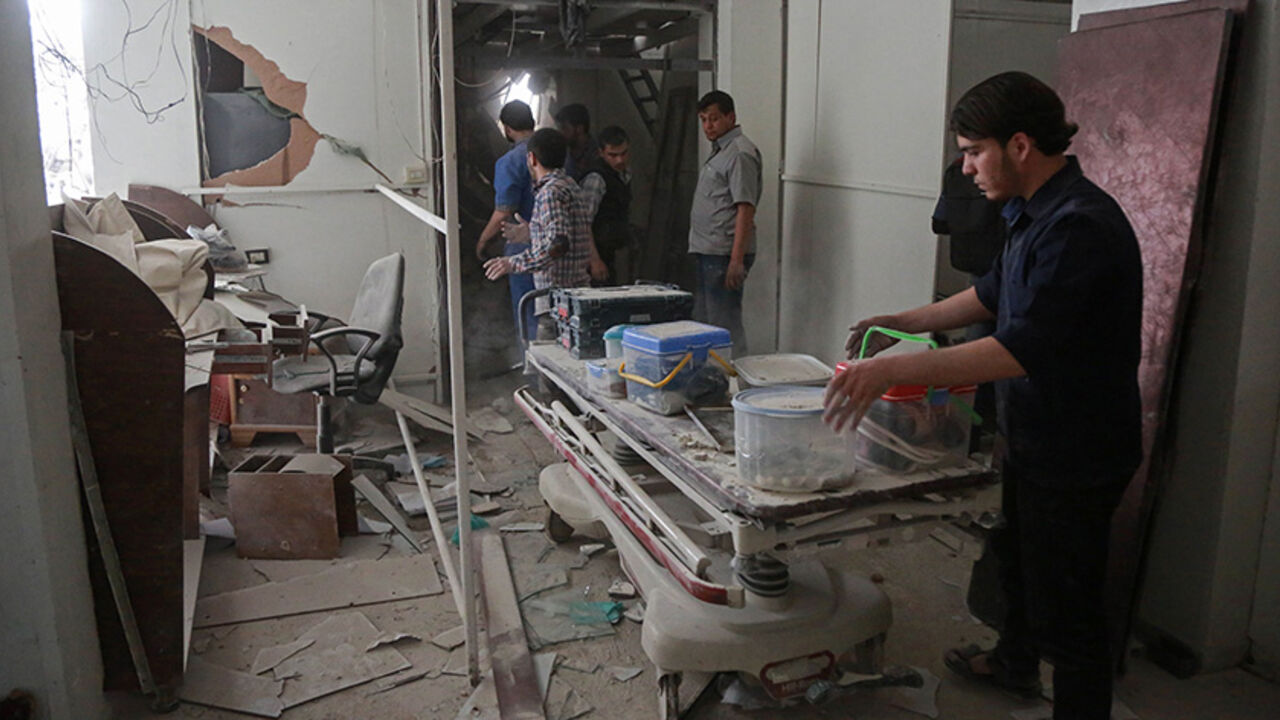 AFP_O07K0 Syrians salvage medical items from a hospital following an air strike a rebel-controlled town in the eastern Ghouta region on the outskirts of the capital Damascus on May 1, 2017.
/ AFP PHOTO / AMER ALMOHIBANY (Photo credit should read AMER ALMOHIBANY/AFP/Getty Images)
