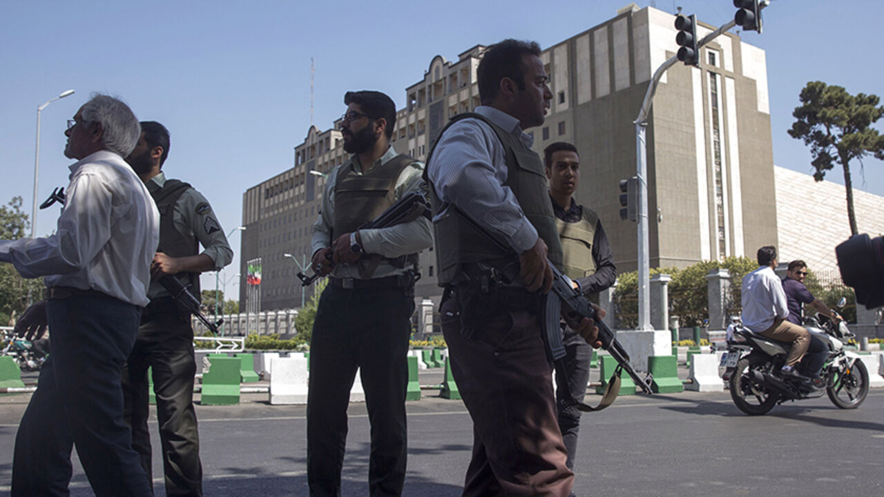 96146891 TEHRAN, IRAN - JUNE 7: Police officers stand outside Iran's parliament building following an attack by several gunmen on June 7, 2017 in Tehran, Iran. At least 12 people were killed and dozens more wounded during simultaneous gun and suicide bomb attacks in Iran's capital. A suicide bomber targeted the shrine of Ayatollah Ruhollah Khomeini while several gunmen launched an attack on the parliament building, which is now reportedly over following hours of audible gun-fire. (Photo by Majid Saeedi/Getty Images