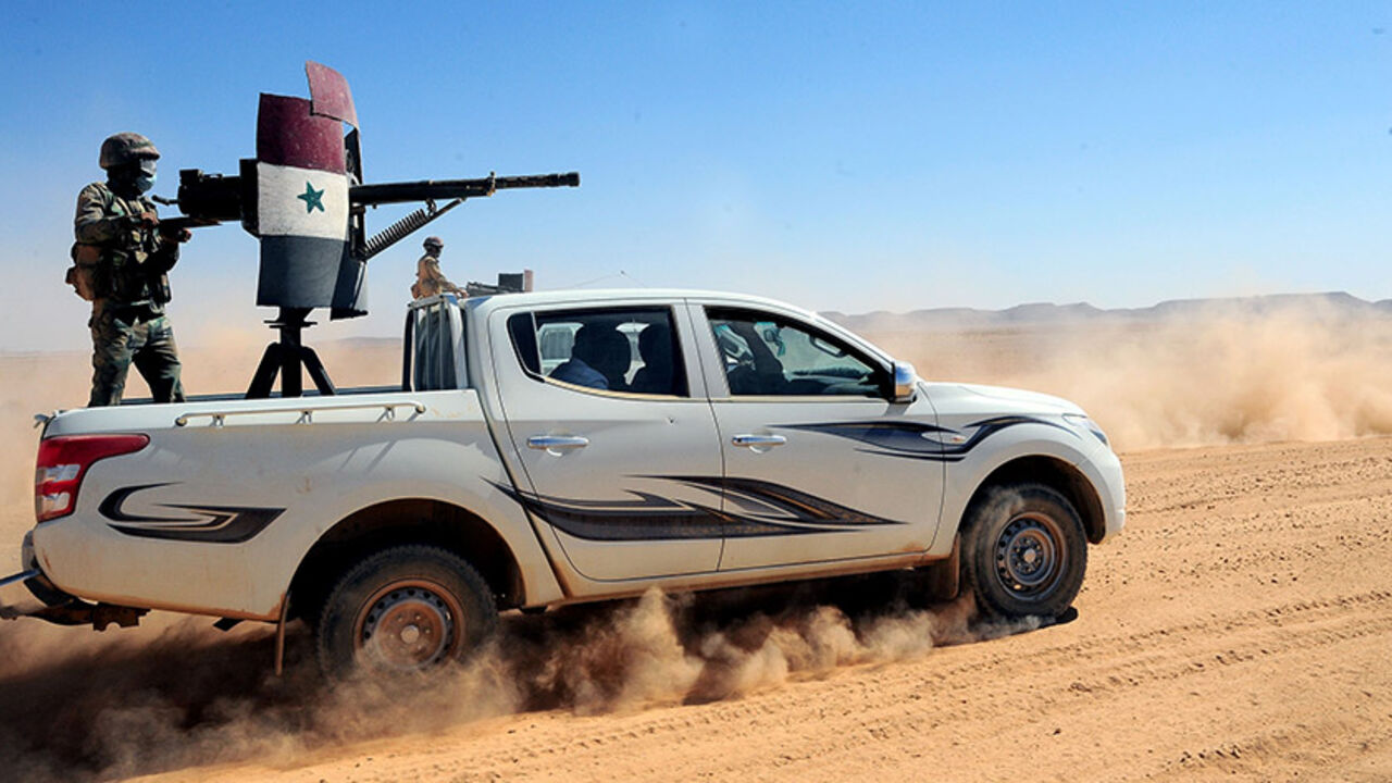 Forces loyal to Syria's President Bashar al-Assad ride on pick-up trucks mounted with weapons in the Badia, in the southeast Syrian desert, in this handout picture provided by SANA on June 13, 2017, Syria. SANA/Handout via REUTERS ATTENTION EDITORS - THIS PICTURE WAS PROVIDED BY A THIRD PARTY. REUTERS IS UNABLE TO INDEPENDENTLY VERIFY THE AUTHENTICITY, CONTENT, LOCATION OR DATE OF THIS IMAGE. - RTS16TTU