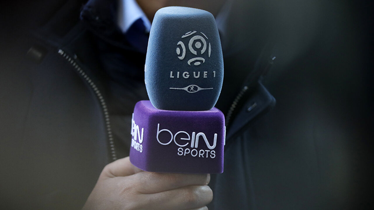 FRANCE-BUSINESS/ The logo of French TV channel 'beIN Sports' is seen on a microphone used by a TV journalist prior to a French league one soccer match at the Parc des Princes Stadium in Paris, March 5, 2016. REUTERS/Christian Hartmann - RTS9MY4