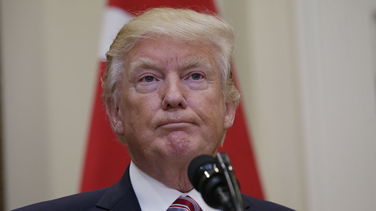 USA-TURKEY/ U.S President Donald Trump listens to Turkey's President Recep Tayyip Erdogan as they give statements to reporters in the Roosevelt Room of the White House in Washington, U.S. May 16, 2017. REUTERS/Kevin Lamarque - RTX363JL