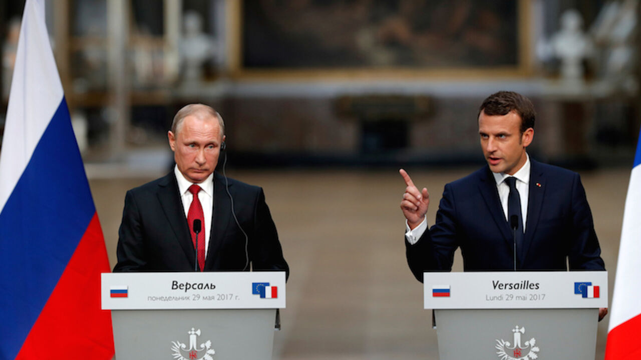 FRANCE-RUSSIA/ French President Emmanuel Macron (R) and Russian President Vladimir Putin (L) give a joint press conference at the Chateau de Versailles before the opening of an exhibition marking 300 years of diplomatic ties between the two countries in Versailles, France, May 29, 2017. REUTERS/Philippe Wojazer TPX IMAGES OF THE DAY - RTX385T3