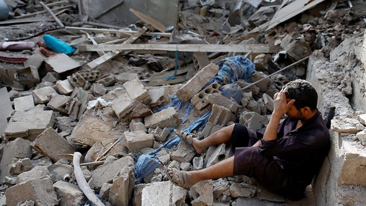 YEMEN-SECURITY/ A man sits on the rubble of a house of his relatives, destroyed by a Saudi-led air strike in Sanaa, Yemen June 9, 2017. REUTERS/Khaled Abdullah - RTX39RM6