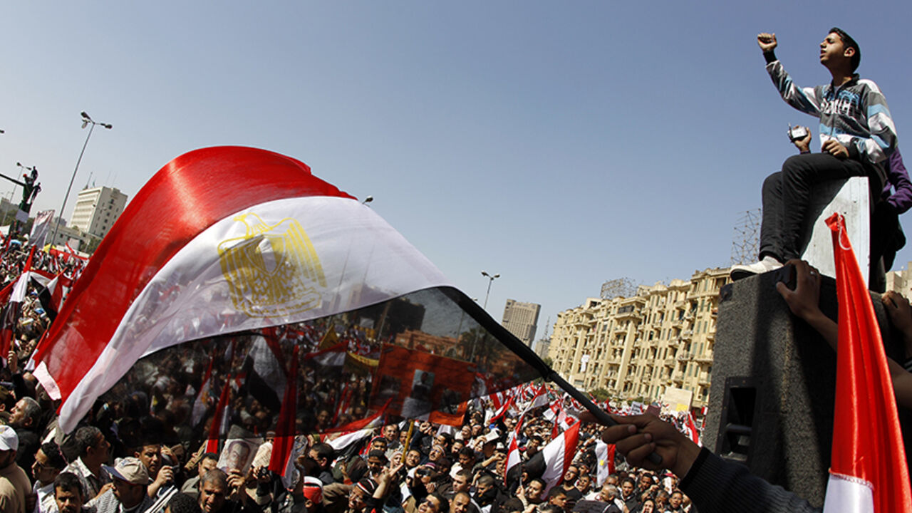 EGYPT/ People wave Egyptian flags during a pro-democracy rally at Tahrir Square, in Cairo March 4, 2011. Egypt's new Prime Minister-designate Essam Sharaf told thousands of protesters in Tahrir Square on Friday that he would work to meet their demands and saluted the "martyrs" of the country's revolution. REUTERS/Peter Andrews (EGYPT - Tags: CIVIL UNREST POLITICS IMAGES OF THE DAY) - RTR2JFEF