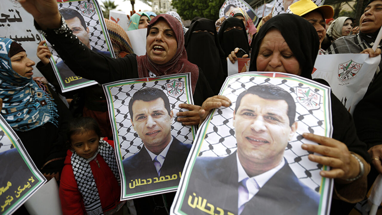 Nic6398310 Palestinian supporters of dismissed senior Fatah leader Mohammed Dahlan shout slogans during a protest to support him on December 18, 2014 in Gaza City. Thousands of supporters of exiled Palestinian strongman Mohammed Dahlan demonstrated in Gaza to protest the reported sacking of dozens of members of the security forces who back him. AFP PHOTO/ MOHAMMED ABED (Photo credit should read MOHAMMED ABED/AFP/Getty Images)