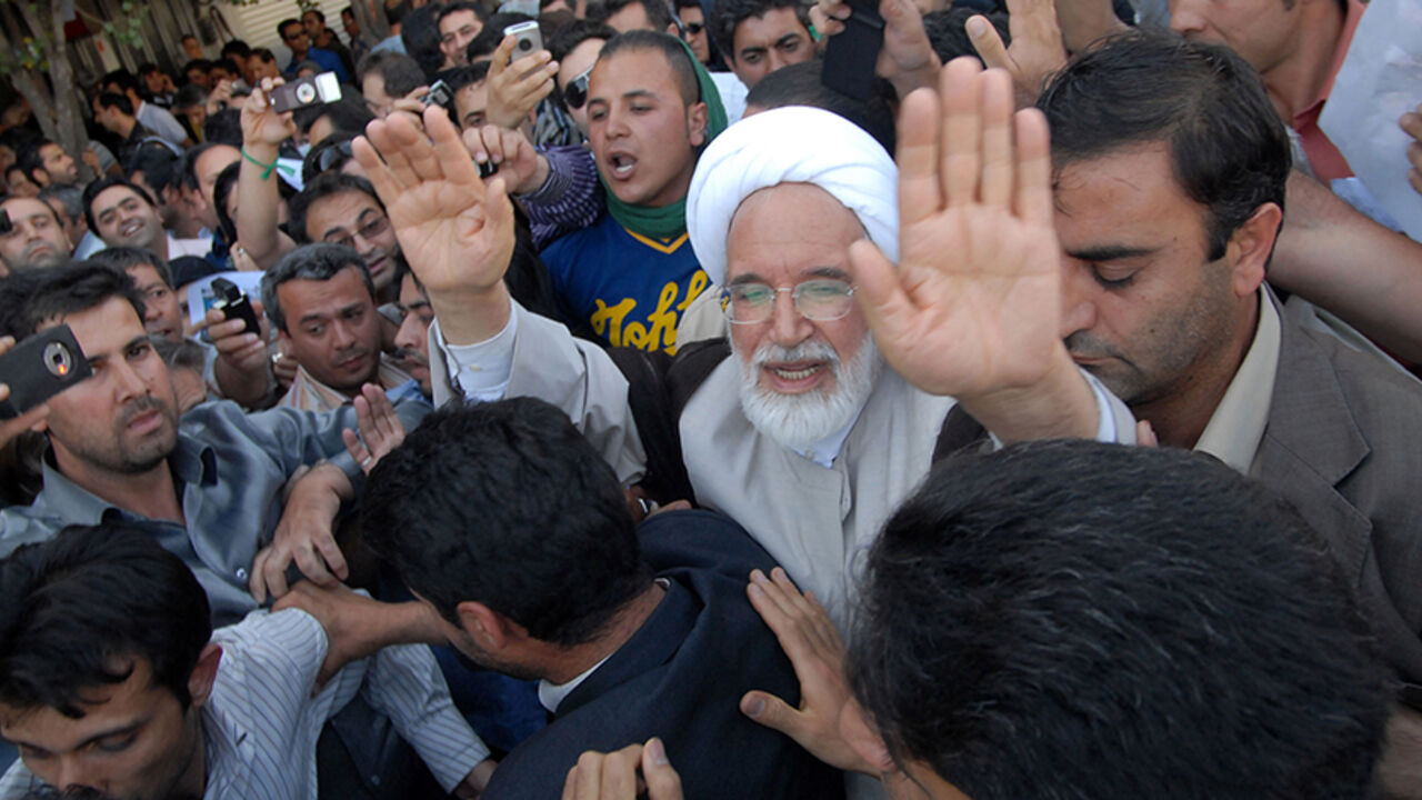 IRAN-ELECTION/ EDITORS' NOTE: Reuters and other foreign media are subject to Iranian restrictions on leaving the office to report, film or take pictures in Tehran.
Iran's presidential candidate Mehdi Karroubi (3rd R) joins a crowd of supporters in Tehran June 17, 2009. REUTERS/Demotix (IRAN POLITICS ELECTIONS CONFLICT) - RTR24RIO