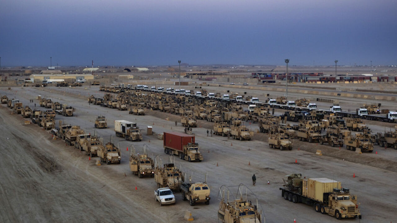 IRAQ-WITHDRAWAL/ Vehicles of the 3rd Brigade Combat Team, 1st Cavalry Division line up for the departure of the final convoy of U.S. military forces out of Iraq at Camp Adder near Nasiriyah, Iraq on December 17, 2011. REUTERS/Lucas Jackson/Pool (IRAQ - Tags: MILITARY CONFLICT POLITICS) - RTR2VDWN