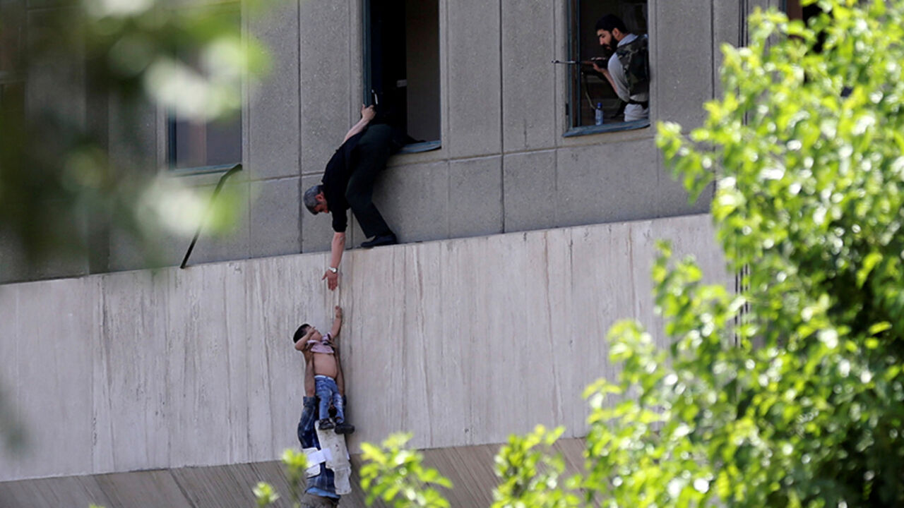 IRAN-PARLIAMENT/CHILD† Two-year-old Emad is evacuated during an attack on the Iranian parliament in central Tehran, Iran, June 7, 2017. Omid Vahabzadeh/TIMA via REUTERS/ File Photo ATTENTION EDITORS - THIS IMAGE WAS PROVIDED BY A THIRD PARTY. FOR EDITORIAL USE ONLY. THIS PICTURE WAS PROCESSED BY REUTERS TO ENHANCE QUALITY. AN UNPROCESSED VERSION HAS BEEN PROVIDED SEPARATELY. SEARCH "IRAN EMAD" FOR THIS STORY. SEARCH "WIDER IMAGE" FOR ALL STORIES. TPX IMAGES OF THE DAY TPX IMAGES OF THE DAY - RTS181NE