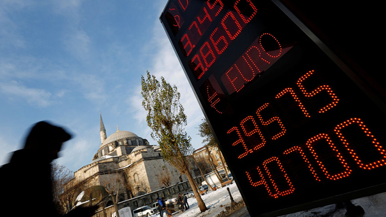 TURKEY-LIRA/ A board showing the currency exchange rates of the U.S. dollar and the Euro against Turkish lira is on display at a currency exchange office in Istanbul, Turkey, January 11, 2017. REUTERS/Murad Sezer - RTX2YFYP