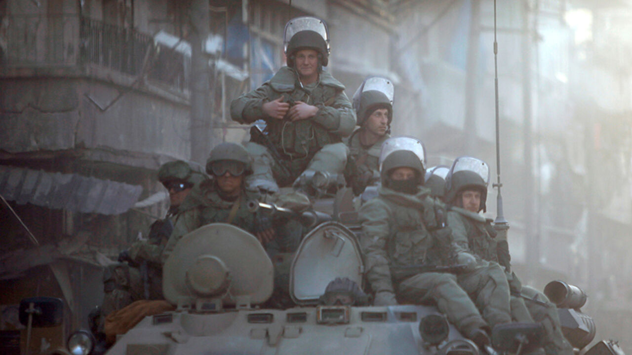 MIDEAST-CRISIS/ALEPPO-INFRASTRUCTURE Russian soldiers, on armoured vehicles, patrol a street in Aleppo, Syria February 2, 2017. Picture taken February 2, 2017. REUTERS/Omar Sanadiki - RTX30GQ1