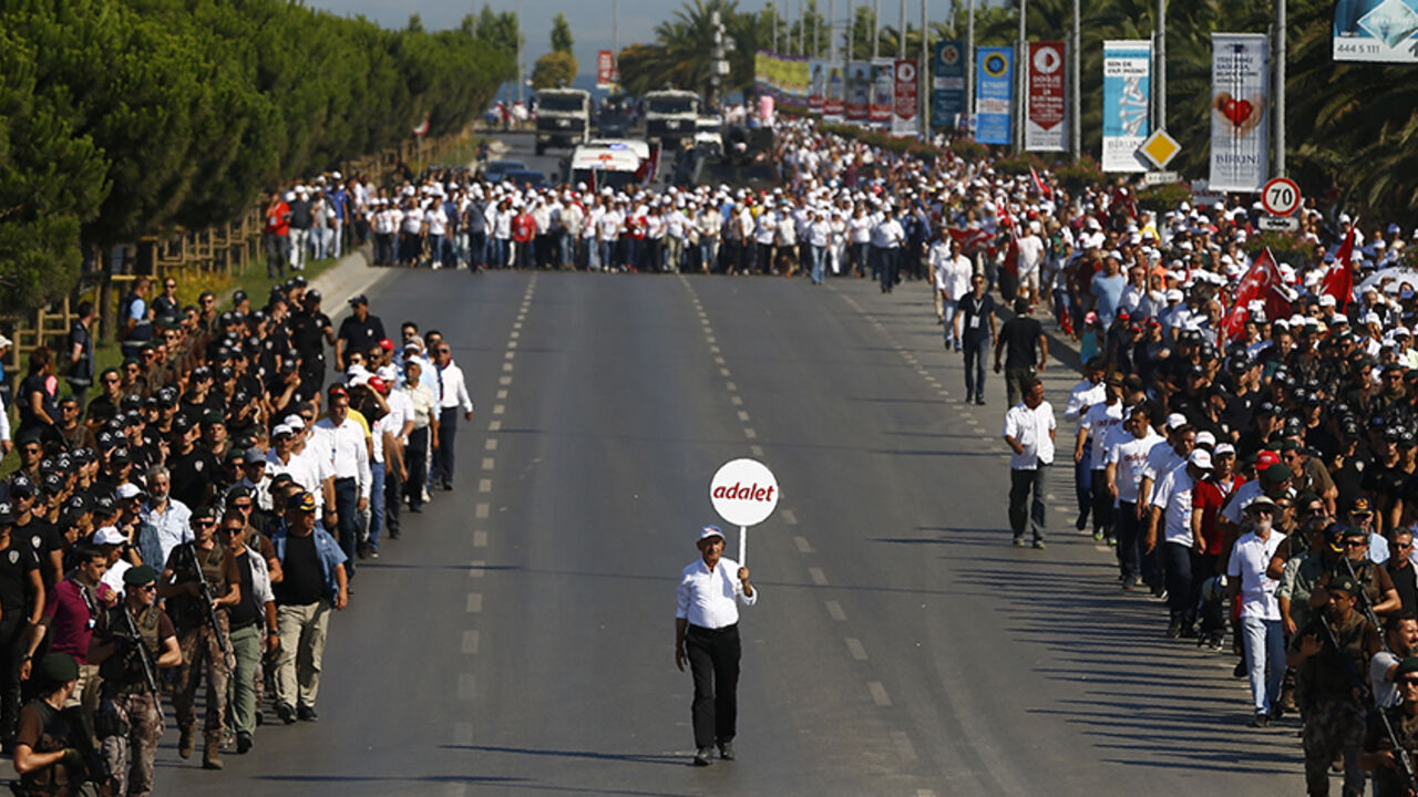TURKEY-SECURITY/MARCH Turkeyís main opposition Republican Peopleís Party (CHP) leader Kemal Kilicdaroglu walks on the final stage of his 25-day long protest, dubbed ìJustice Marchî, against the detention of the partyís lawmaker Enis Berberoglu, in Istanbul, Turkey, July 9, 2017. Placards read "Justice". REUTERS/Osman Orsal - RTX3AQ1H