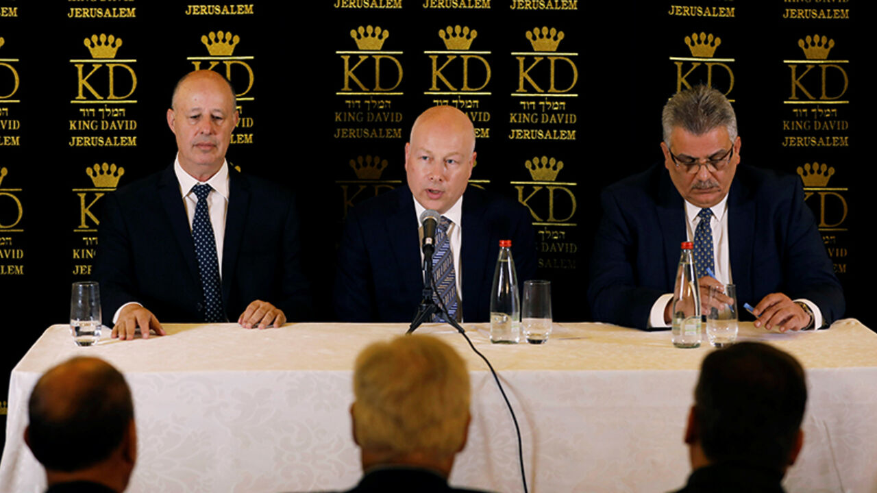 ISRAEL-PALESTINIANS/USA-WATER Jason Greenblatt (C), U.S. President Donald Trump's Middle East envoy, sits next to Tzachi Hanegbi (L), Israeli Minister of Regional Cooperation and Mazen Ghoneim, head of the Palestinian Water Authority, during a news conference in Jerusalem July 13, 2017. REUTERS/Ronen Zvulun - RTX3B939