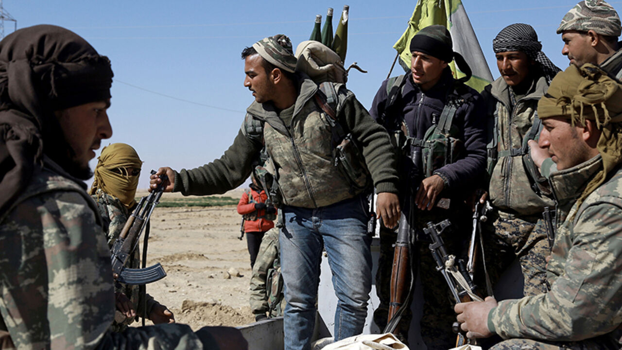 US-backed Syrian Democratic Forces (SDF), made up of an alliance of Arab and Kurdish fighters, regroup in the village of Sabah al-Khayr on the northern outskirts of Deir Ezzor as they advance to encircle the Islamic State (IS) group bastion of Raqa on February 21, 2017.
The SDF made a major incursion into the oil-rich province of Deir Ezzor as part of their push for Raqa, field commander Dejwar Khabat said. 



 / AFP / DELIL SOULEIMAN        (Photo credit should read DELIL SOULEIMAN/AFP/Getty Images)