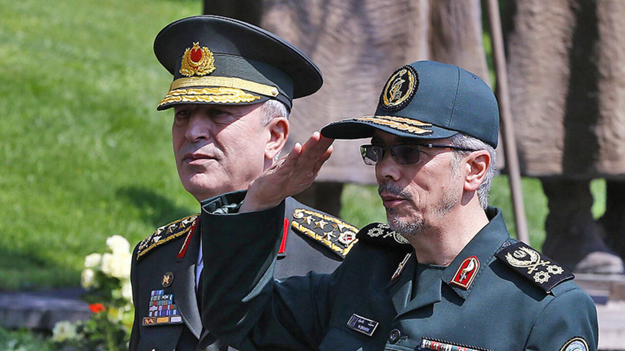 AFP_RL3I5 General Staff of the Armed Forces of Iran, Mohammad Bagheri (R) salutes the honor guards as he is welcomed by Chief of the General Staff of the Turkish Armed Forces Hulusi Akar (L) during his official visit at the Turkish General Staff headquarters in Ankara, on August 15, 2017. / AFP PHOTO / STR (Photo credit should read STR/AFP/Getty Images)