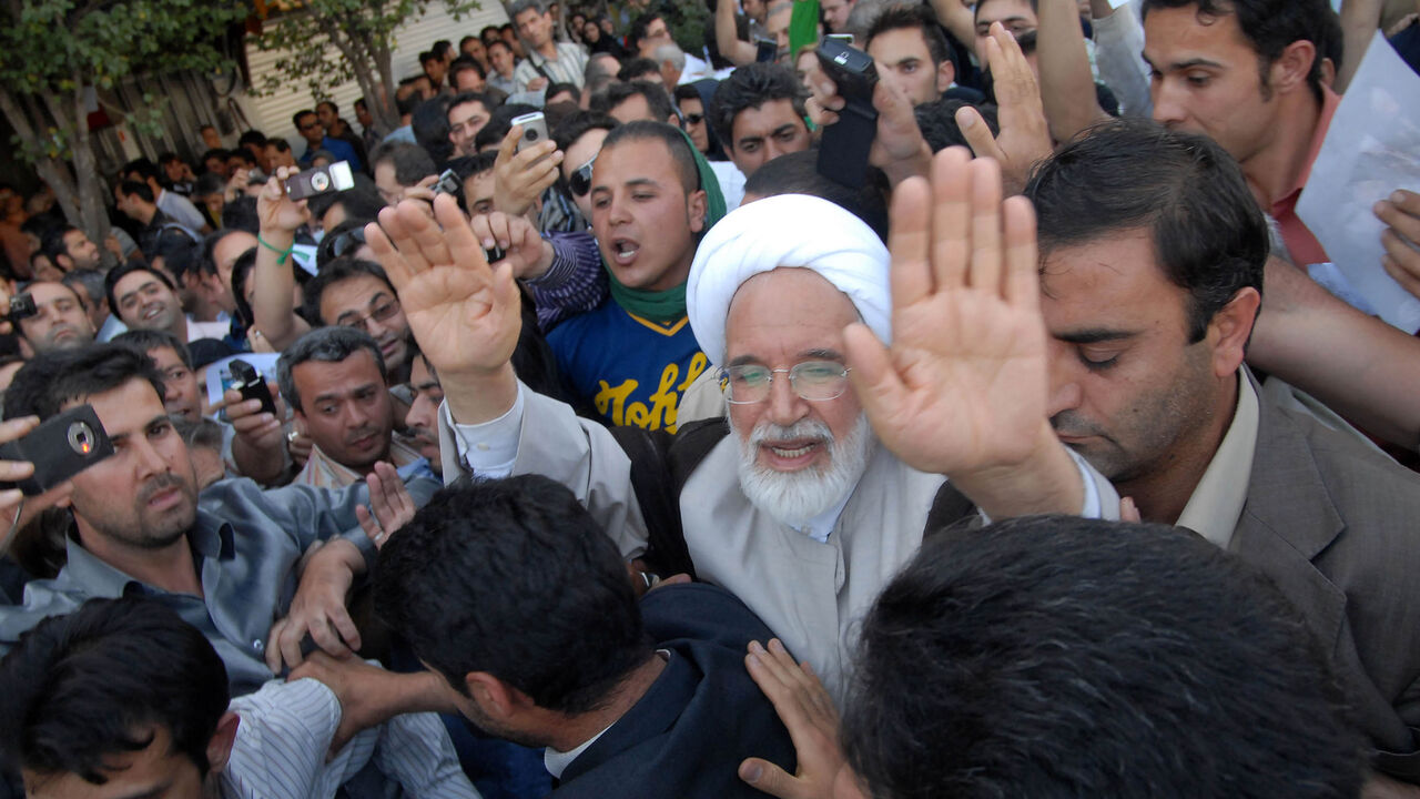 IRAN-ELECTION/ EDITORS' NOTE: Reuters and other foreign media are subject to Iranian restrictions on leaving the office to report, film or take pictures in Tehran.
Iran's presidential candidate Mehdi Karroubi (3rd R) joins a crowd of supporters in Tehran June 17, 2009. REUTERS/Demotix (IRAN POLITICS ELECTIONS CONFLICT) - RTR24RIO