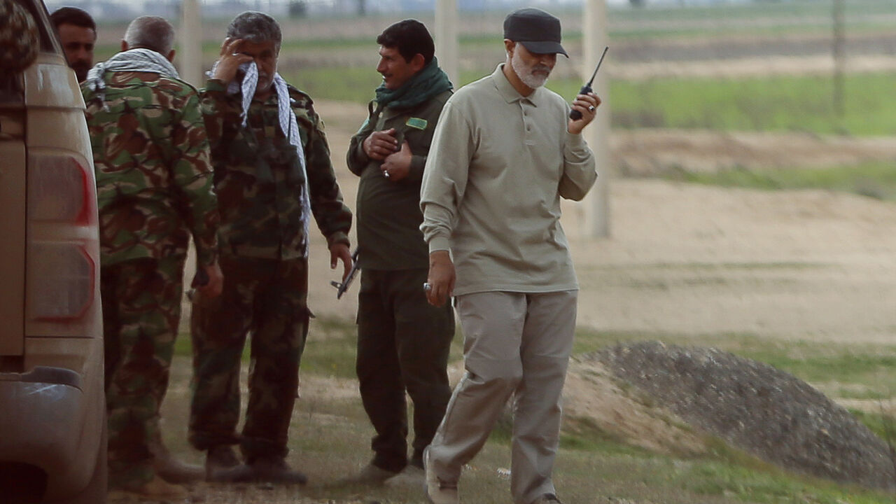 Iranian Revolutionary Guard Commander Qassem Soleimani uses a walkie-talkie at the frontline during offensive operations against Islamic State militants in the town of Tal Ksaiba in Salahuddin province March 8, 2015. Picture taken March 8, 2015.   REUTERS/Stringer (IRAQ - Tags: CIVIL UNREST CONFLICT POLITICS) - RTR4TU0N