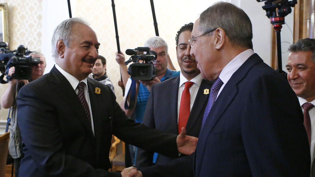 General Khalifa Haftar (L), commander in the Libyan National Army (LNA), shakes hands with Russian Foreign Minister Sergei Lavrov during a meeting in Moscow, Russia August 14, 2017. REUTERS/Sergei Karpukhin - RTS1BPIW