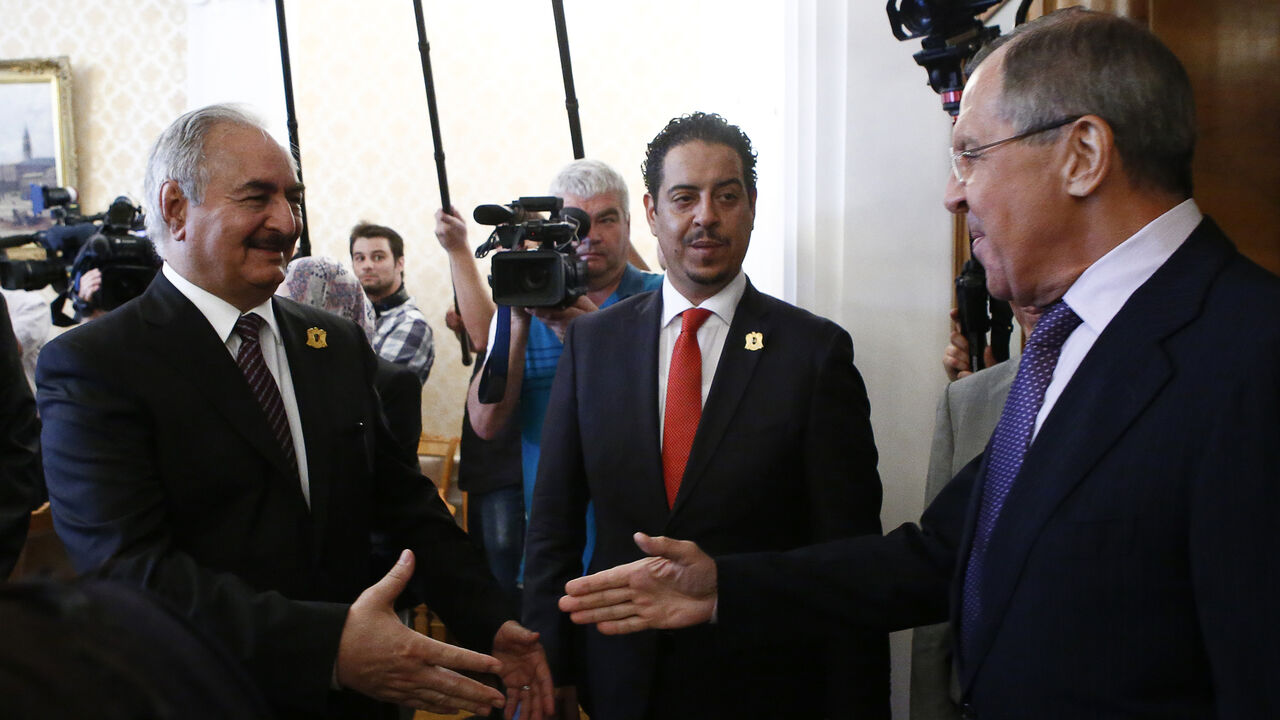 LIBYA-SECURITY/RUSSIA Russian Foreign Minister Sergei Lavrov (R) welcomes General Khalifa Haftar (L), commander in the Libyan National Army (LNA), during a meeting in Moscow, Russia August 14, 2017. REUTERS/Sergei Karpukhin - RTS1BPNE