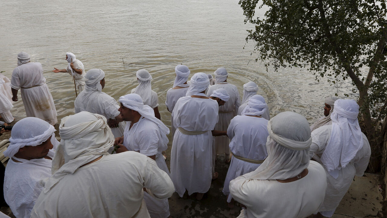 Mandaeans perform religious rituals during the Benja festival along the Tigris river in Baghdad March 16, 2016. REUTERS/Ahmed Saad - RTSAP9A