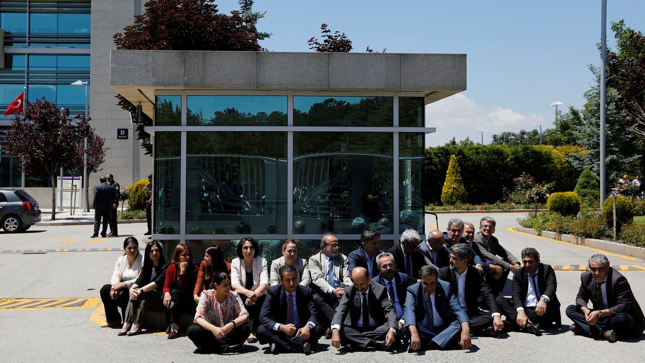TURKEY-SECURITY/LAWMAKER Pro-Kurdish Peoples' Democratic Party (HDP) lawmakers hold a sit-in to protest against detention of lawmakers, outside the Constitutional Court in Ankara, Turkey June 16, 2017. REUTERS/Umit Bektas - RC16564D3C40