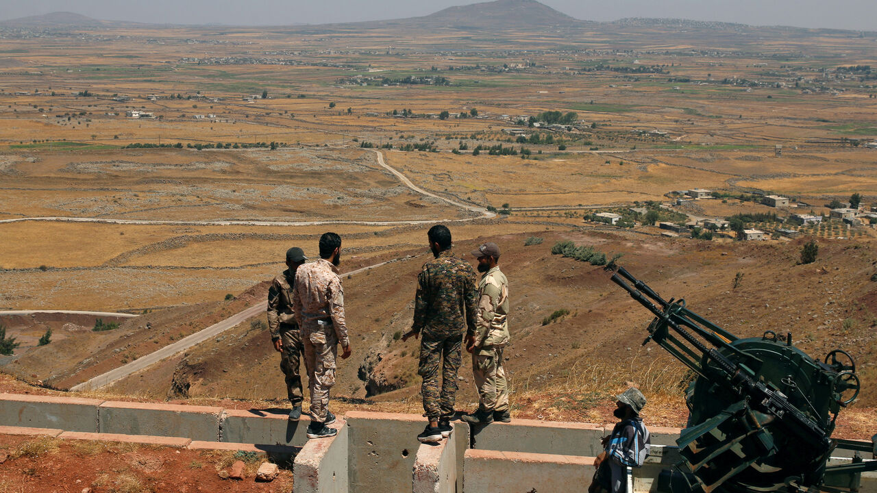 MIDEAST-CRISIS/SYRIA Free Syrian army fighters stand together in Quneitra countryside, Syria August 24, 2017. REUTERS/Alaa Al-Faqir - RC12C4FF3250