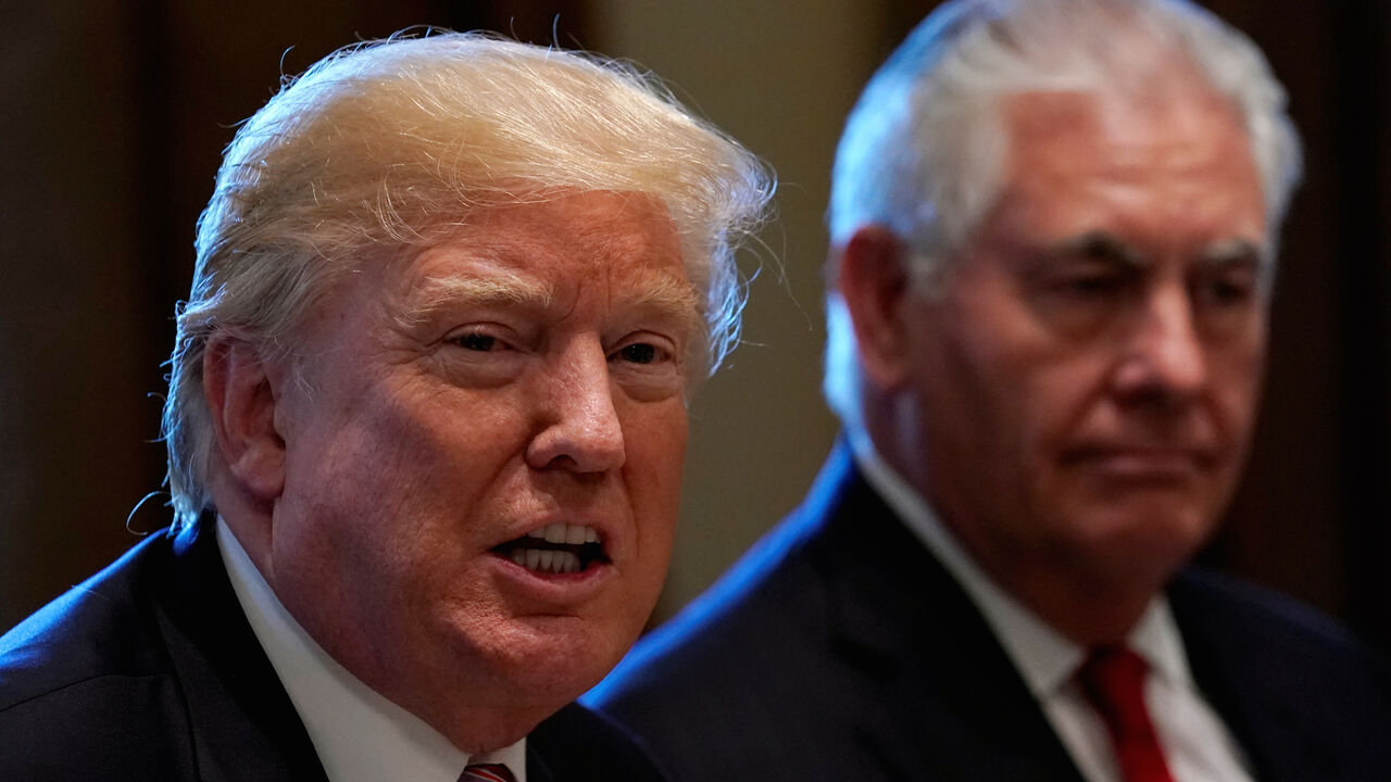 USA-KUWAIT/ With Secretary of State Rex Tillerson (R) at his side, U.S. President Donald Trump speaks during a luncheon with Kuwait's ruler Sheikh Sabah al-Ahmad al-Jaber al-Sabah at the White House in Washington, U.S., September 7, 2017. REUTERS/Kevin Lamarque - RC187C106320