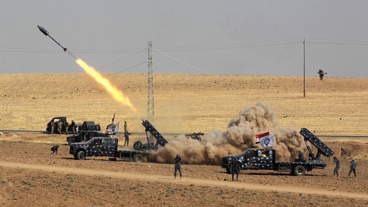AFP_TR2GZ TOPSHOT - A picture taken on October 26, 2017 shows rockets being launched from Iraqi security forces' against Kurdish Peshmerga positions in the area of Faysh Khabur, which is located on the Turkish and Syrian borders in the Iraqi Kurdish autonomous region. / AFP PHOTO / AHMAD AL-RUBAYE (Photo credit should read AHMAD AL-RUBAYE/AFP/Getty Images)