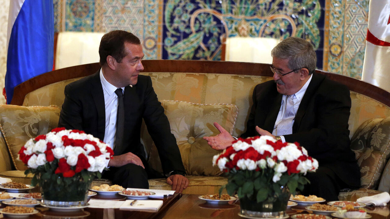 ALGERIA-RUSSIA/ Algerian Prime Minister Ahmed Ouyahia meets his Russian counterpart Dmitry Medvedev upon his arrival at Algiers airport, Algeria October 9, 2017. Picture taken October 9, 2017. Sputnik/Dmitry Astakhov/Pool via REUTERS ATTENTION EDITORS - THIS IMAGE WAS PROVIDED BY A THIRD PARTY. - RC1CBAD54670