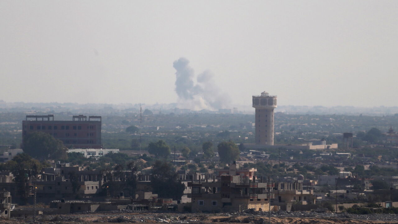 EGYPT-SECURITY/SINAI Smoke rises in Egypt's North Sinai as seen from the border of southern Gaza Strip with Egypt July 1, 2015. Islamic State militants launched a wide-scale coordinated assault on several military checkpoints in Egypt's North Sinai on Wednesday in which 50 people were killed, security sources said, the largest attack yet in the insurgency-hit province. REUTERS/Ibraheem Abu Mustafa TPX IMAGES OF THE DAY - GF10000145811