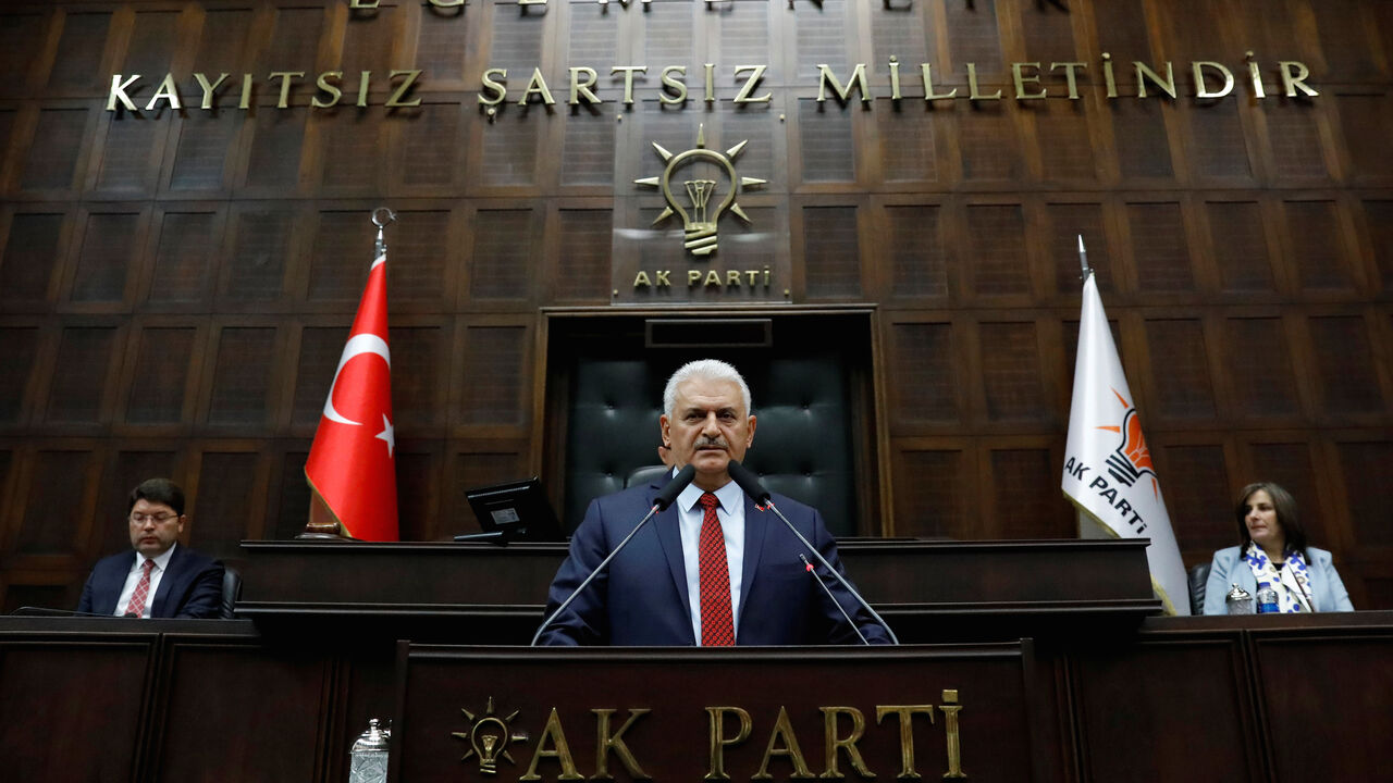 TURKEY-POLITICS/ Turkey's Prime Minister Binali Yildirim addresses members of parliament from his ruling AK Party (AKP) during a meeting at the Turkish parliament in Ankara, Turkey, April 18, 2017. REUTERS/Umit Bektas - RC18BE492CA0