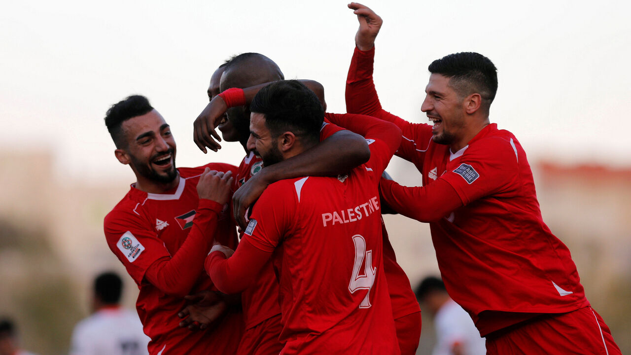 SOCCER-ASIA-PSE-BTN/ Soccer Football - AFC Asian Cup Qualifiers - Palestine vs Bhutan - Hebron, Palestinian Territories - October 10, 2017 Palestine's players celebrate after scoring. REUTERS/Mohamad Torokman - RC1A16BBC980