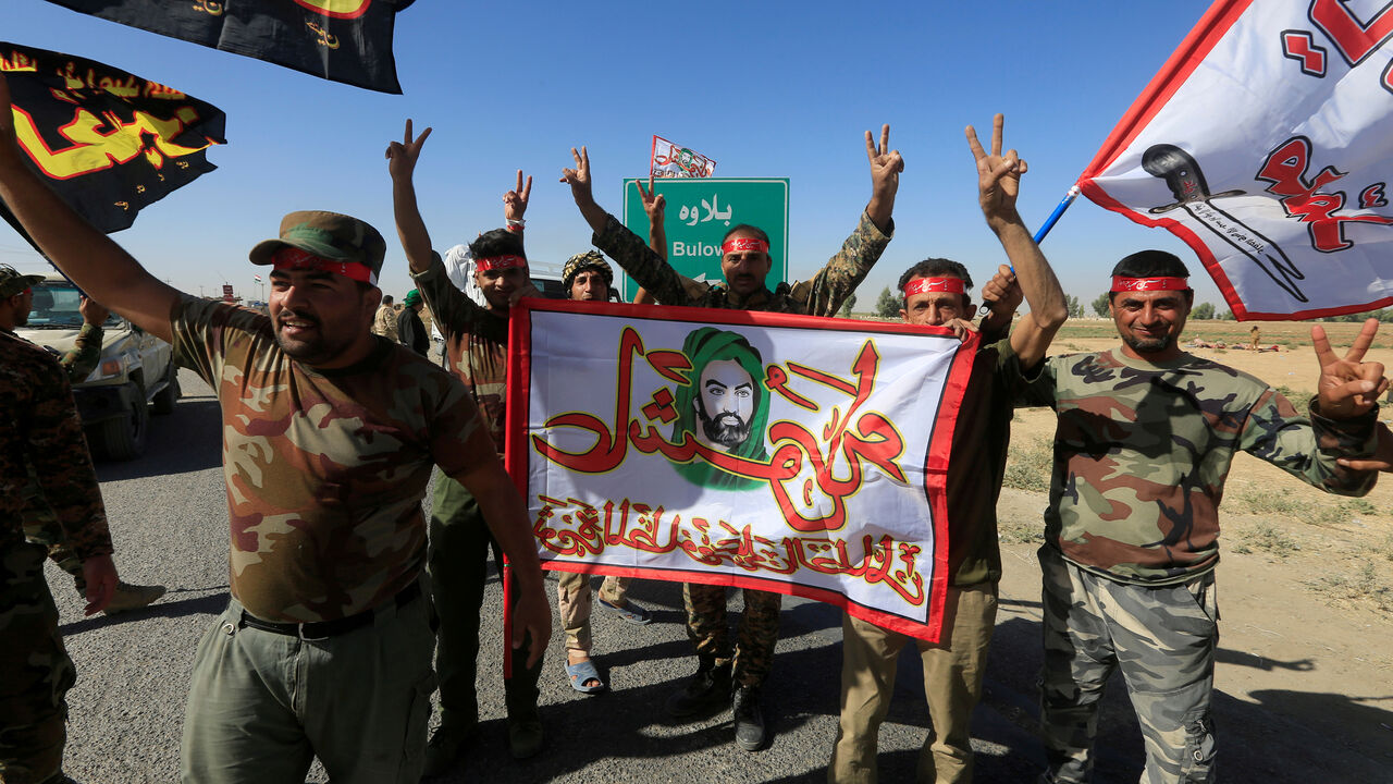Shi'ite Popular Mobilization Forces (PMF) celebrate on the outskirts of Kirkuk, Iraq October 17, 2017. REUTERS/Alaa Al-Marjani TPX IMAGES OF THE DAY - RC14D2FF7B50