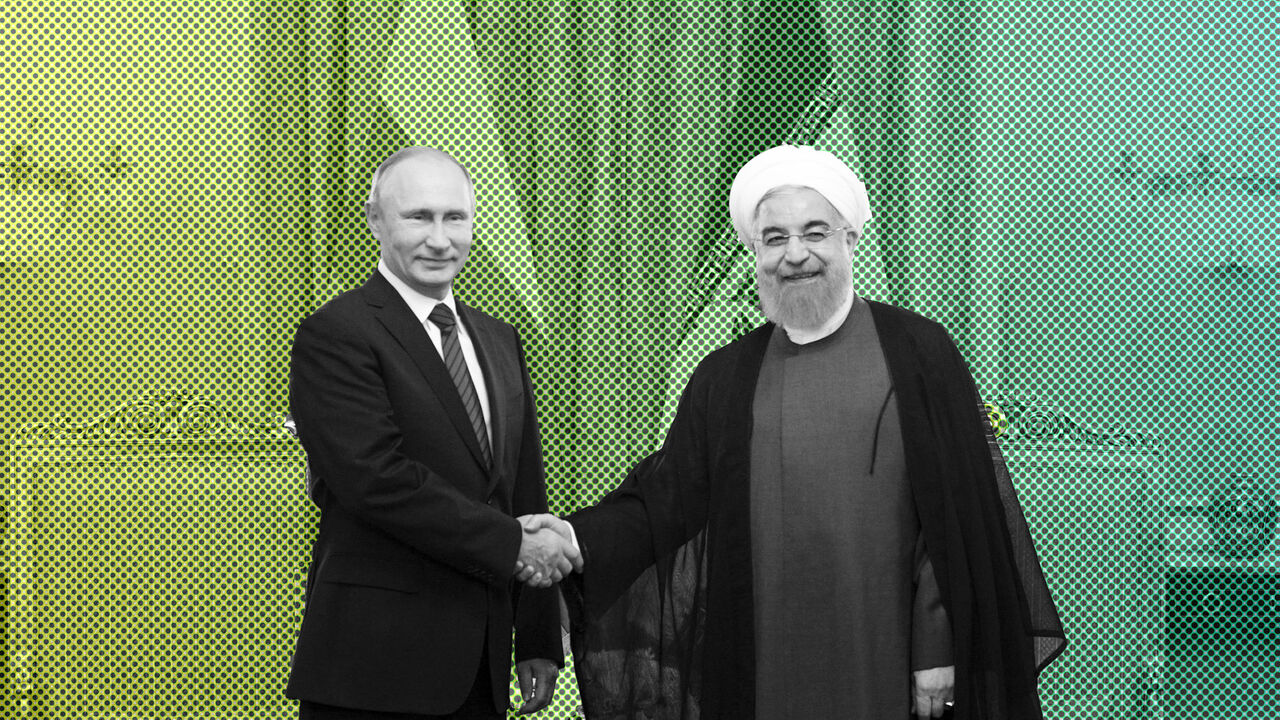 IRAN-RUSSIA/PUTIN Russian President Vladimir Putin (L) shakes hands with his Iranian counterpart Hassan Rouhani during a meeting in Tehran, Iran November 1, 2017. Sputnik/Alexei Druzhinin/Kremlin via REUTERS ATTENTION EDITORS - THIS IMAGE WAS PROVIDED BY A THIRD PARTY. - UP1EDB10X4U08
