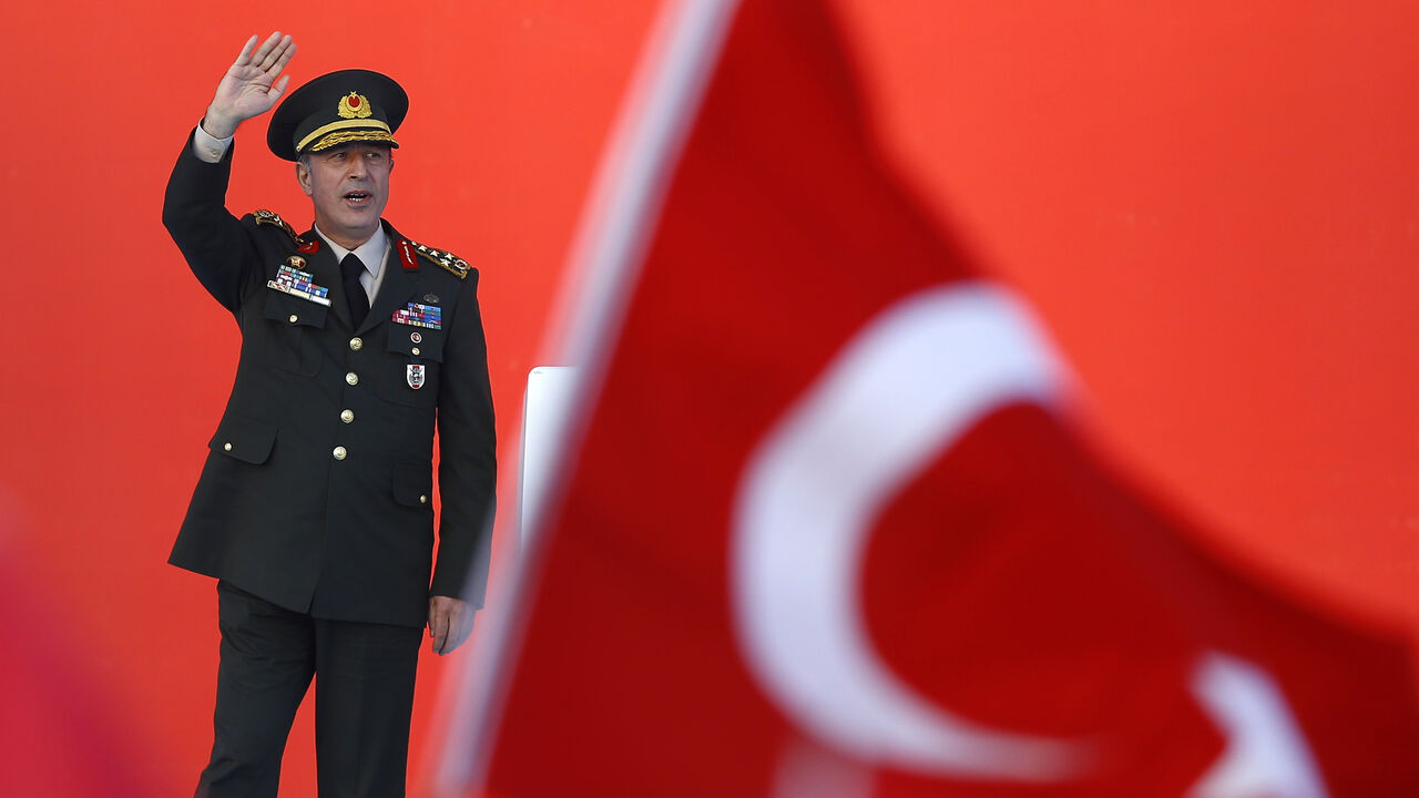 TURKEY-SECURITY/RALLY Turkey's Chief of the General Staff Hulusi Akar greets audience during the Democracy and Martyrs Rally, organized by Turkish President Tayyip Erdogan and supported by ruling AK Party (AKP), oppositions Republican People's Party (CHP) and Nationalist Movement Party (MHP), to protest against last month's failed military coup attempt, in Istanbul, Turkey, August 7, 2016. REUTERS/Osman Orsal - LR1EC871BPP4E