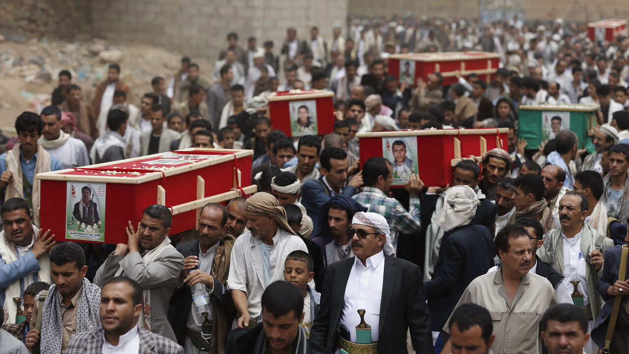 YEMEN-SECURITY/ Houthi followers carry coffins of those killed in a car blast attack on Monday, and a Houthi fighter who was killed during fighting in Yemen's southern port city of Aden, in Sanaa July 22, 2015. Five people were killed in the blast that hit the Moeed mosque in Sanaa, which is used by the Houthis, police sources said. Islamic State's Yemen branch claimed responsibility for the attack, in which seven others were wounded. REUTERS/Khaled Abdullah - GF10000166909