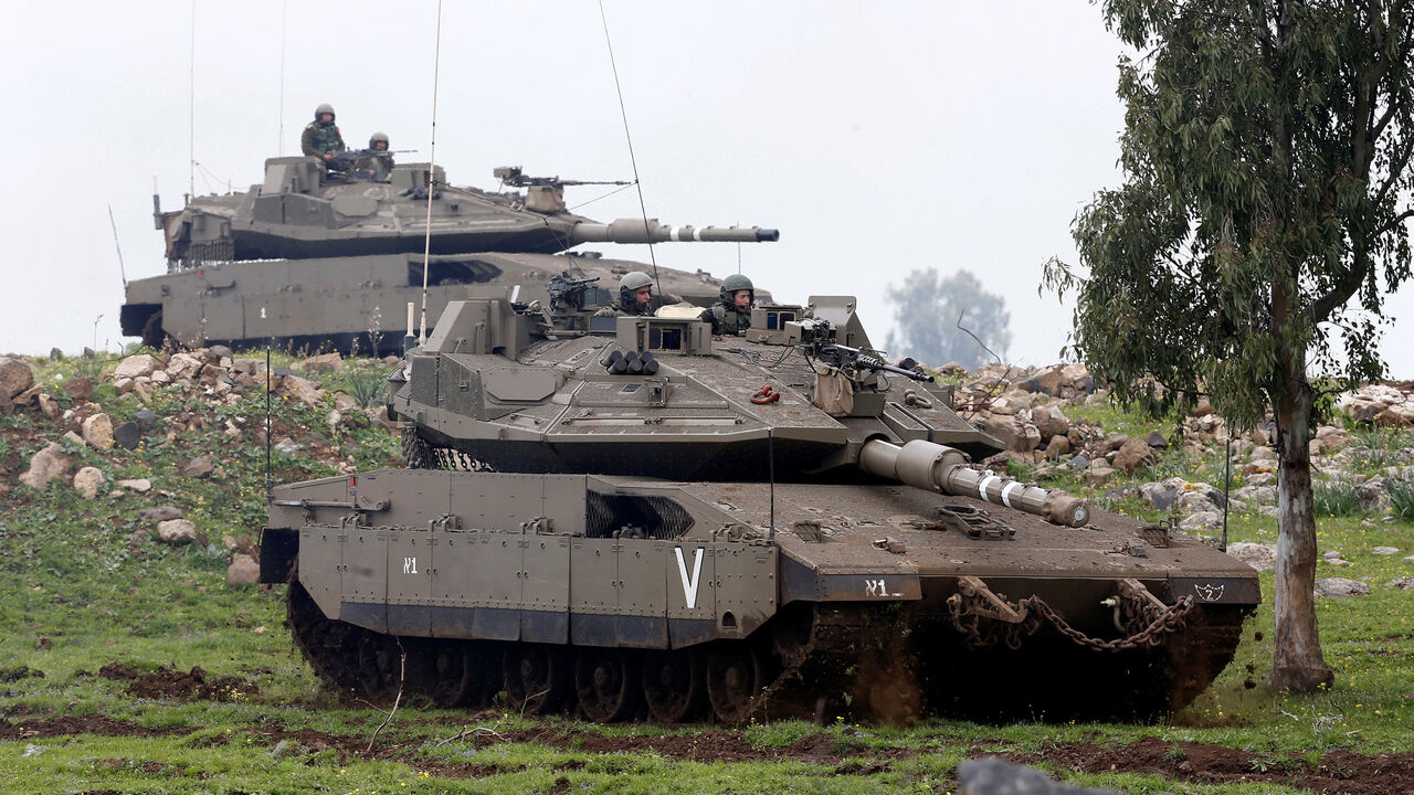 MIDEAST-CRISIS/SYRIA-ISRAEL Israeli soldiers sit on top of tanks as they take part in an exercise in the Israeli-occupied Golan Heights, near the ceasefire line between Israel and Syria, March 20, 2017. REUTERS/Baz Ratner - RC16E85FD020