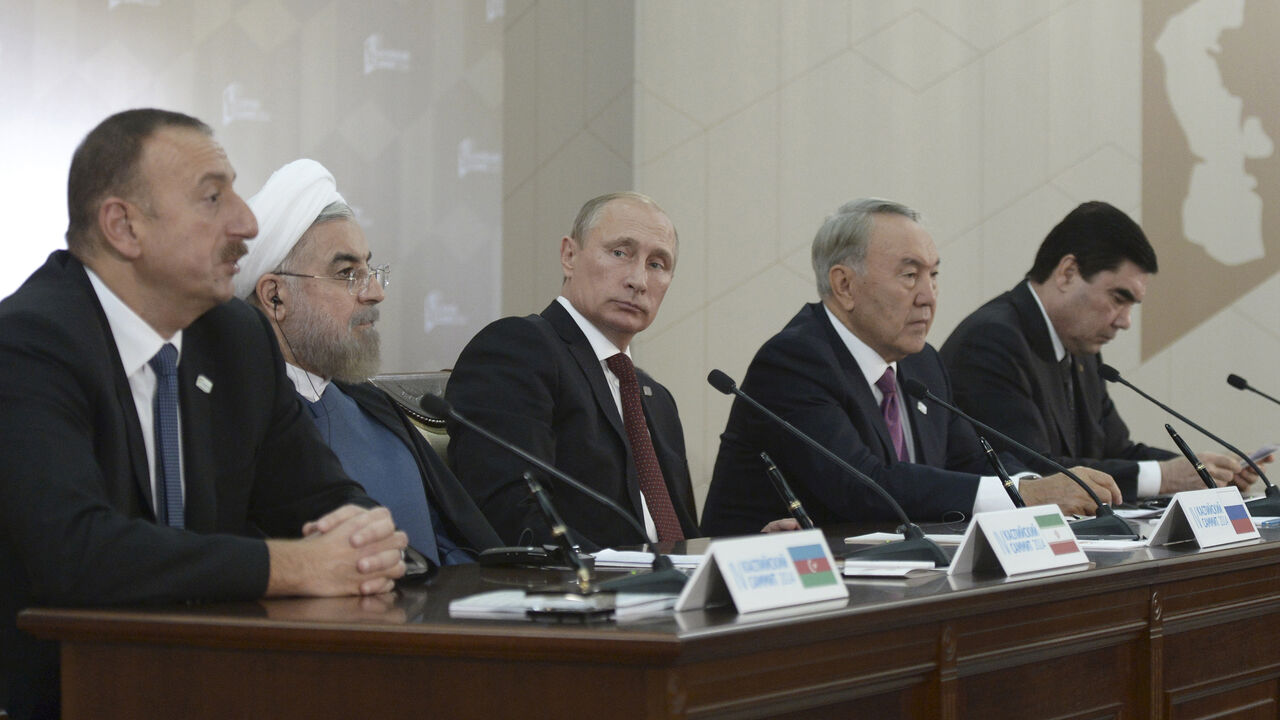 RUSSIA-CASPIAN-SUMMIT/PUTIN-ROUHANI (L-R) Azerbaijan's President Ilham Aliyev, Iran's President Hassan Rouhani, Russia's President Vladimir Putin, Kazakhstan's President Nursultan Nazarbayev and Turkmenistan's President Gurbanguly Berdimuhamedov attend a news conference during a summit of Caspian Sea regional leaders in the southern city of Astrakhan September 29, 2014. REUTERS/Alexei Nikolsky/RIA Novosti/Kremlin (RUSSIA - Tags: POLITICS) THIS IMAGE HAS BEEN SUPPLIED BY A THIRD PARTY. IT IS DISTRIBUTED, EXACTLY AS RECEIVED BY REUTERS, AS A SE