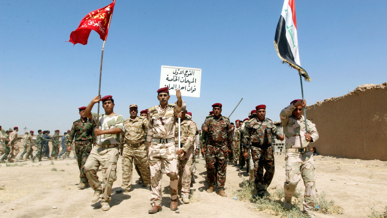 Popular Mobilisation Forces (PMF) march during a military parade in Daquq, nearby Kirkuk, Iraq August 5, 2017. REUTERS/Ako Rasheed - RC1FB5F9F700