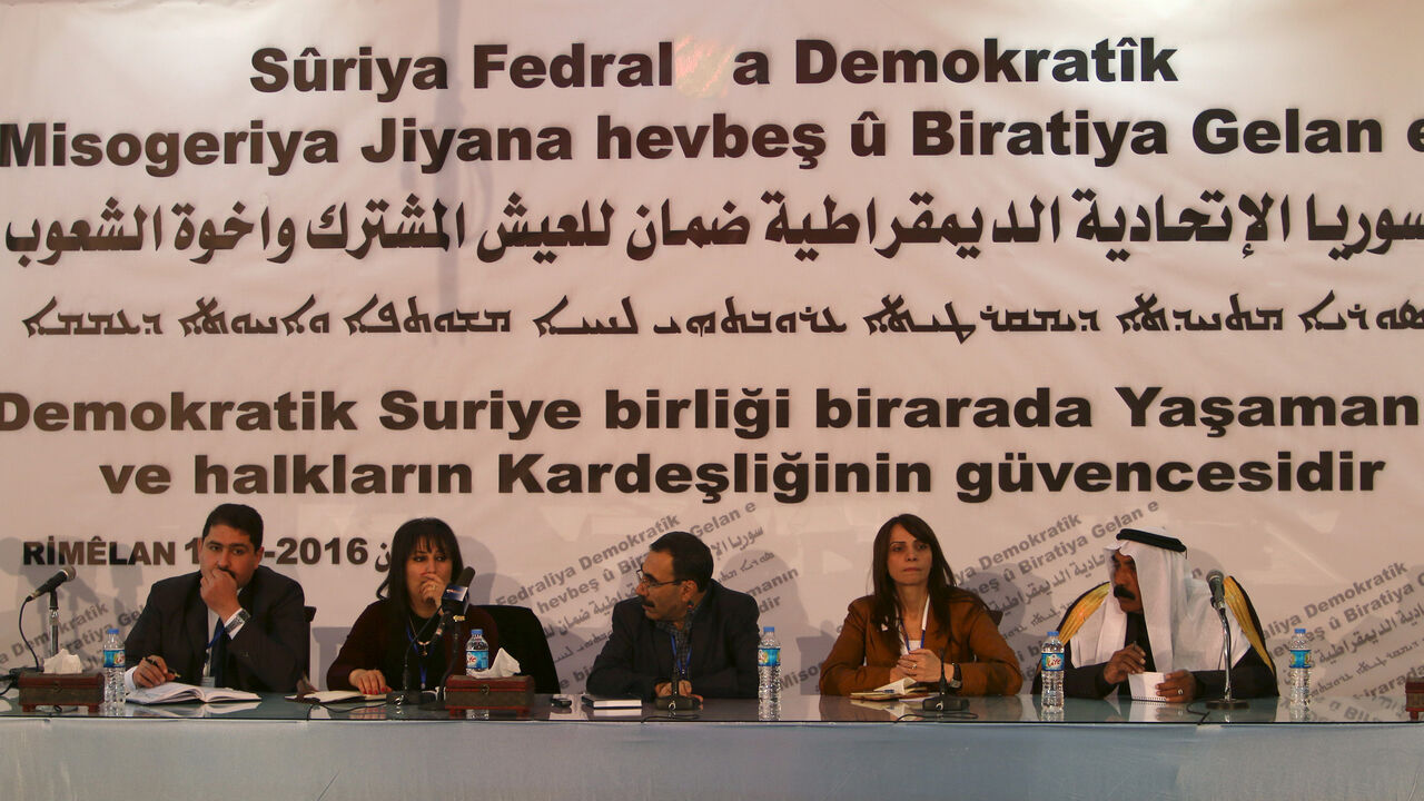 MIDEAST-CRISIS/SYRIA-FEDERALISM Bureau members of a preparatory conference to announce a federal system discuss a "Democratic Federal System for Rojava - Northern Syria" in the Kurdish-controlled town of Rmeilan, Hasaka province, Syria March 16, 2016. REUTERS/Rodi Said - GF10000347792