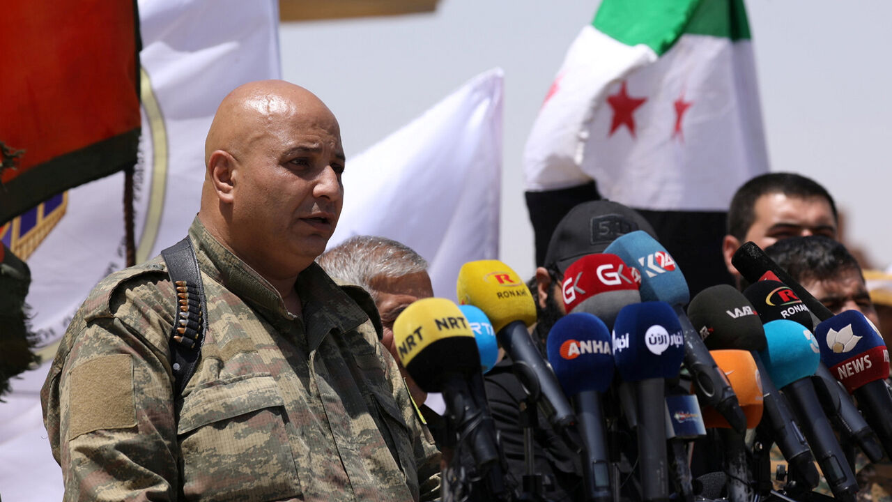 MIDEAST-CRISIS/SYRIA-RAQQA Syrian Democratic Forces (SDF) spokesman Talal Silo speaks during a press conference in Hukoumiya village in Raqqa, Syria June 6, 2017.REUTERS/Rodi Said - RC1543C159D0