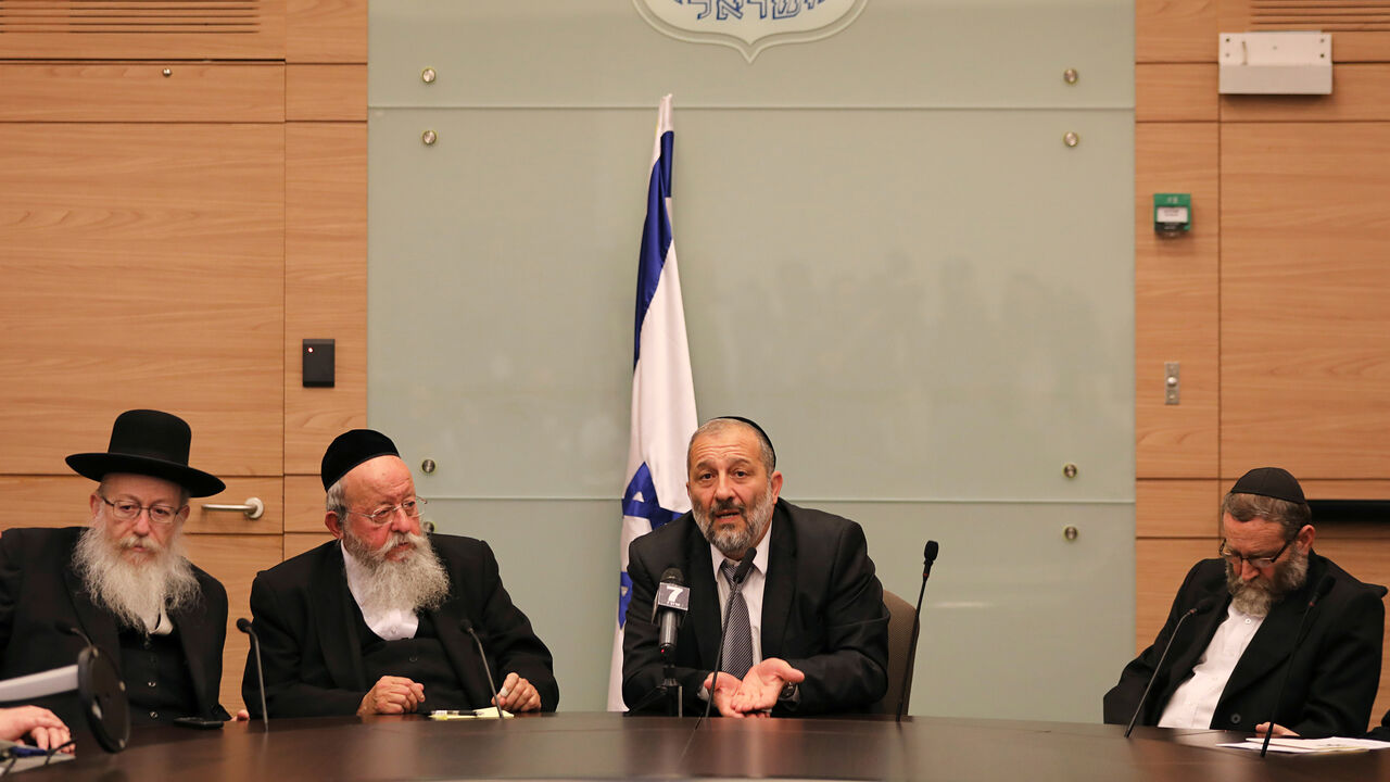 ISRAEL-LAW/RULING Israel's Interior Minister Aryeh Deri (2ndR) the leader of the ultra-Orthodox Shas party, gestures as he sits next to Israel's Health Minister, Yaakov Litzman (L) from United Torah Judaism party, and Moshe Gafni (R) a parliament member from United Torah Judaism party, during a meeting at the Knesset, Israel's parliament, in Jerusalem September 13, 2017. REUTERS/Ammar Awad - RC142C916550