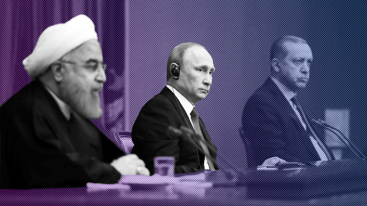 MIDEAST-CRISIS/SYRIA-RUSSIA-SUMMIT Iran's President Hassan Rouhani together with his counterparts, Russia's Vladimir Putin and Turkey's Tayyip Erdogan, attend a joint news conference following their meeting in Sochi, Russia November 22, 2017. Sputnik/Mikhail Klimentyev/Kremlin via REUTERS ATTENTION EDITORS - THIS IMAGE WAS PROVIDED BY A THIRD PARTY. - RC1D16F4FF70