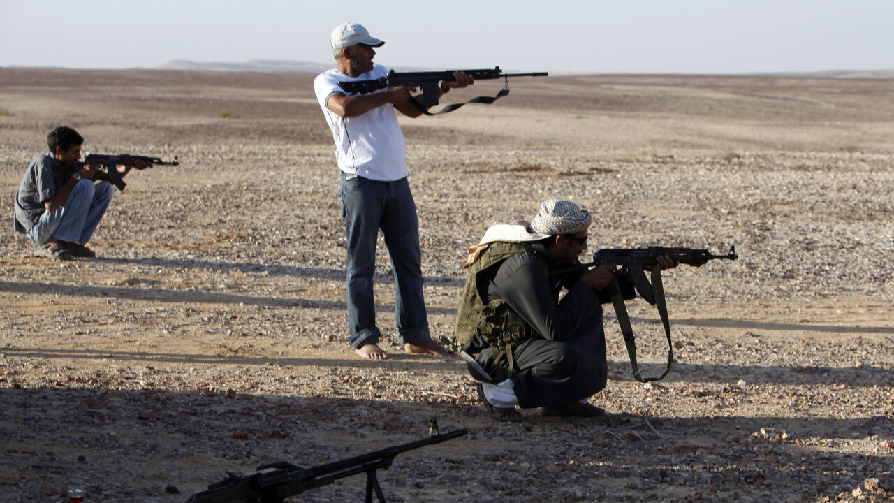 EGYPT/ Bedouins test their weapons in a mountainous region of central Sinai October 24, 2010. Bedouins, among nomadic Arab tribes in the Sinai, often complain of neglect by the government and of police harassment, saying they have little access to jobs and do not see benefits from economic growth in Sinai. REUTERS/Asmaa Waguih (EGYPT - Tags: SOCIETY) - GM1E6AP0A4I01