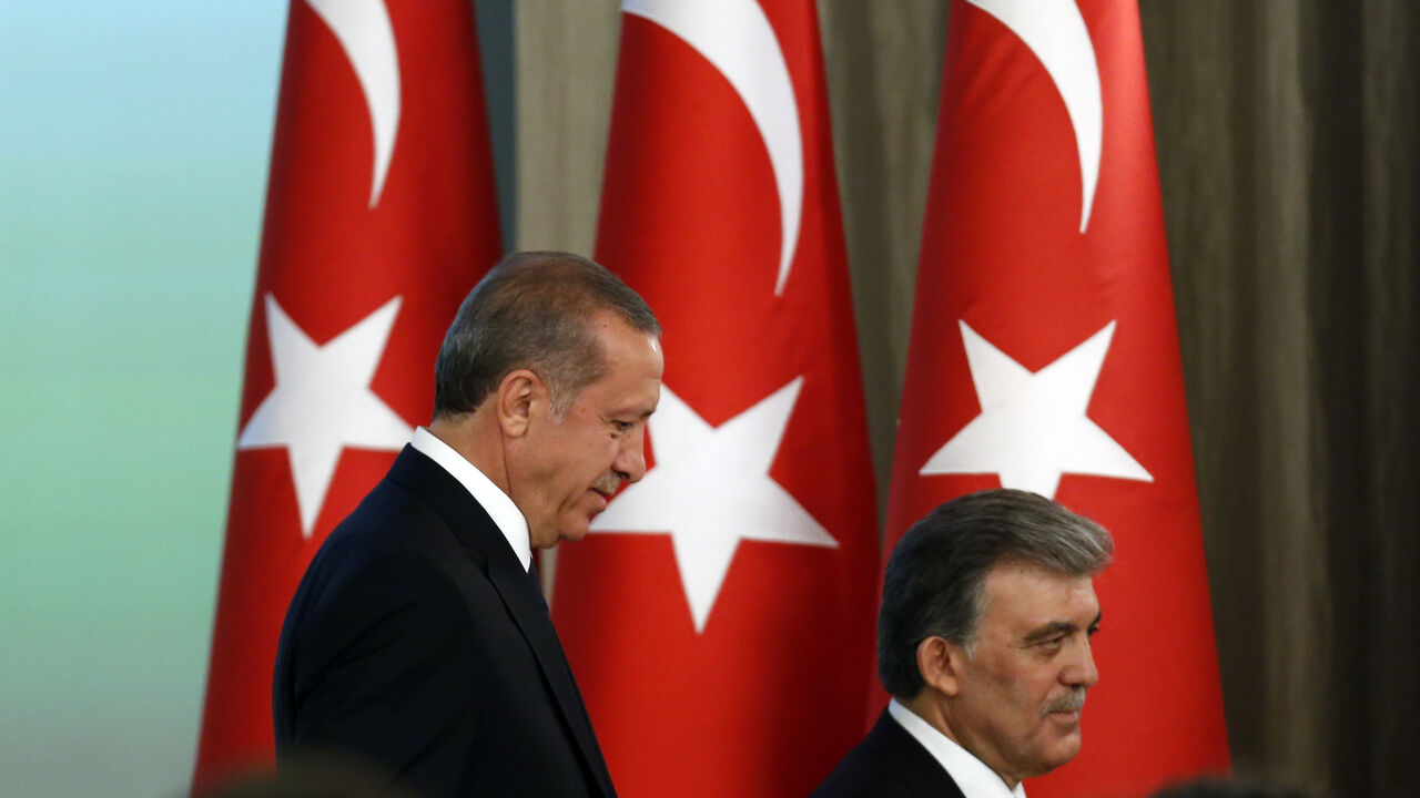 TURKEY-ERDOGAN/PRESIDENT Turkey's new President Tayyip Erdogan (L) and outgoing President Abdullah Gul attend a handover ceremony at the Presidential Palace of Cankaya in Ankara August 28, 2014. Erdogan was sworn in as Turkey's 12th president at a ceremony in parliament on Thursday, cementing his position as the country's most powerful modern leader, in what his opponents fear will herald an increasingly authoritarian rule. REUTERS/Umit Bektas (TURKEY - Tags: POLITICS) - GM1EA8T00E601