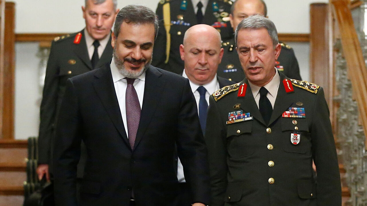 TURKEY-RUSSIA/ Turkey's Chief of Staff General Hulusi Akar (R) and Turkish intelligence chief, Hakan Fidan leave after a meeting with Russian delegation in Istanbul, Turkey, October 10, 2016. REUTERS/Osman Orsal - D1AEUGEUKCAB